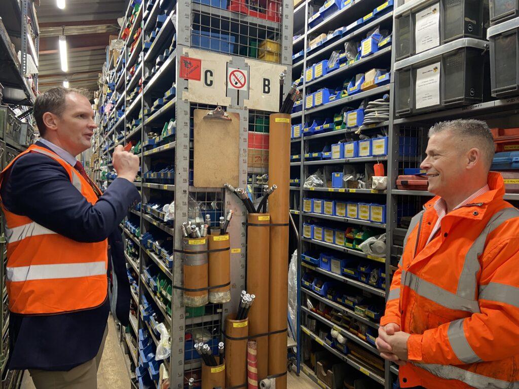 Dr Daniel Poulter MP and Phillip Bell (Managing Director) in the parts stock room at Watson & Hillhouse