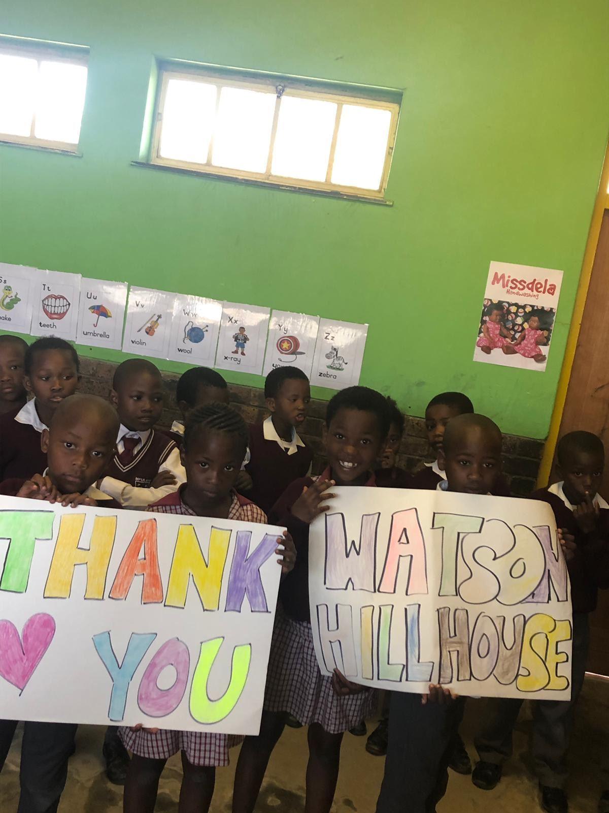 African Children holding thank you banners