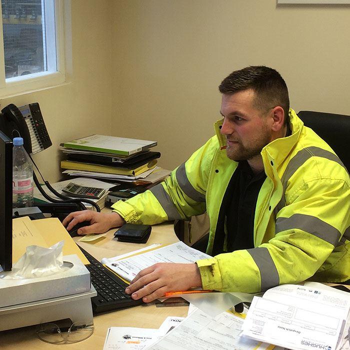 Joe Manning Operations Manager sitting at his desk