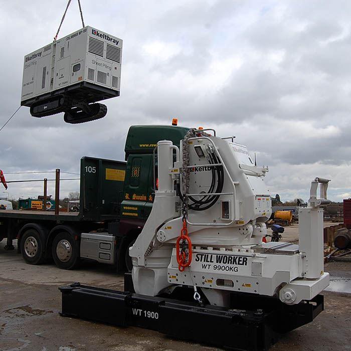 Kowan WP-150 on ground with power pack being craned onto a lorry.