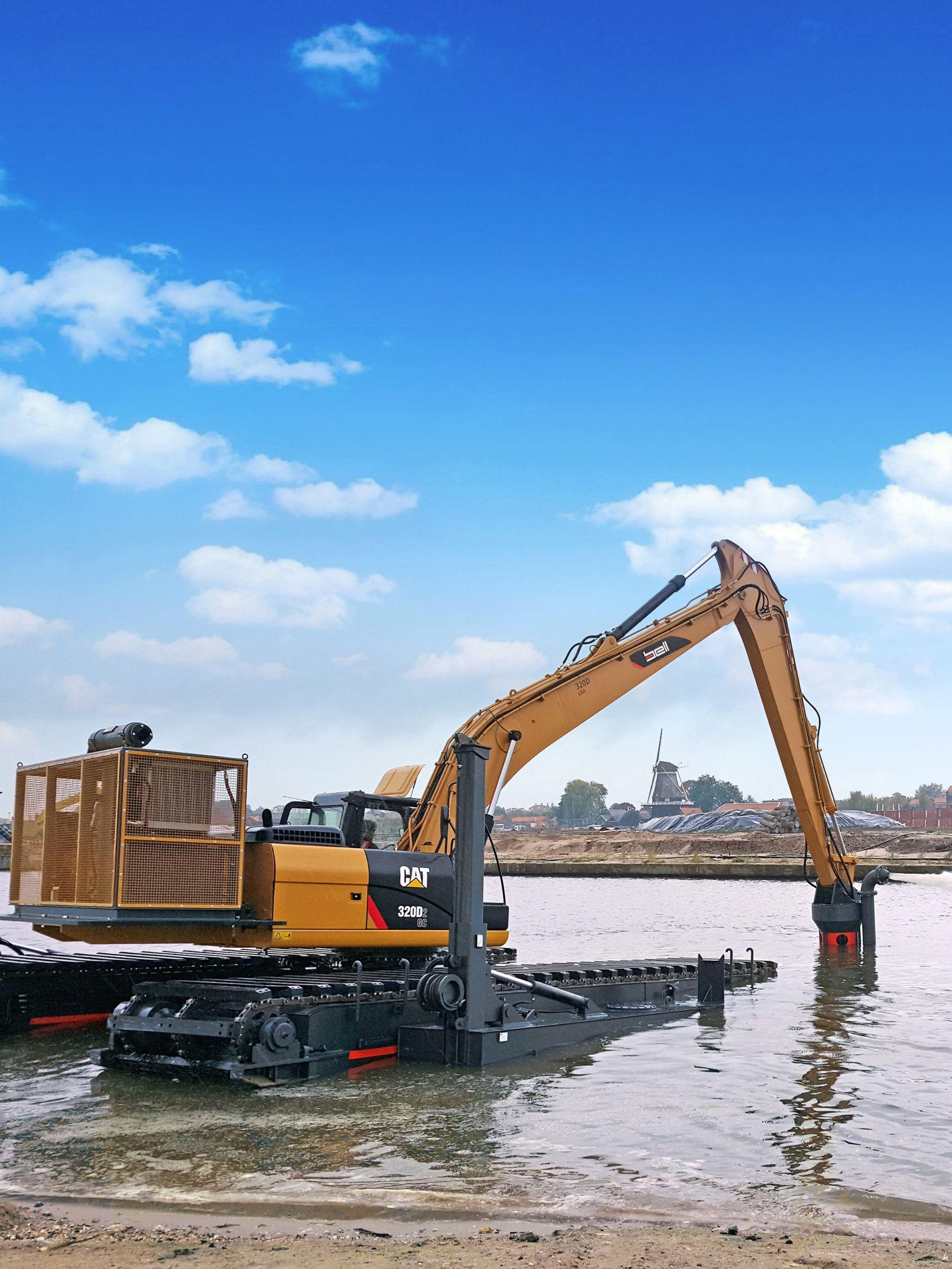 Bell dredging pump on an amphibious excavator with pump in water