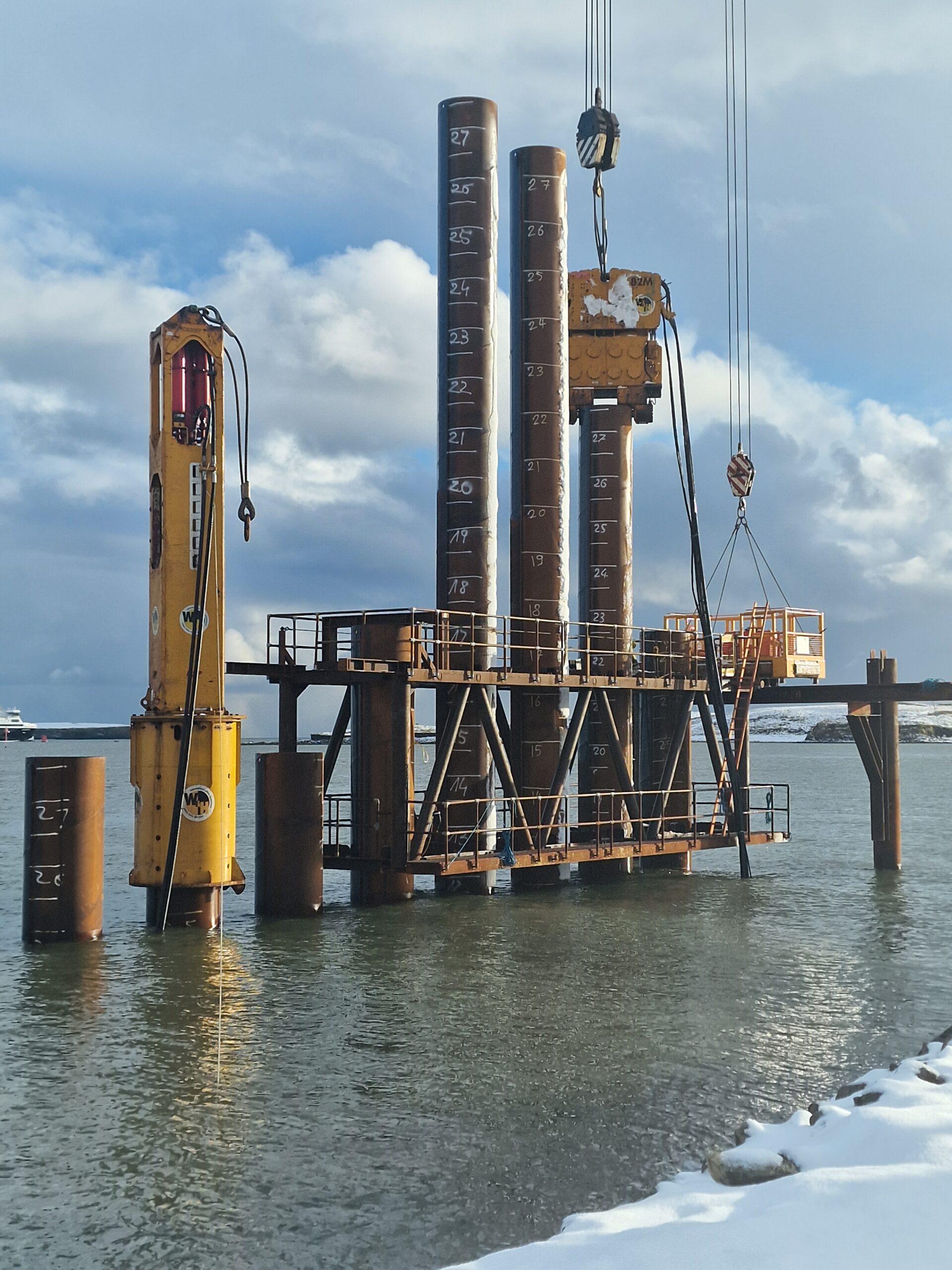 Image showing Watson & Hillhouse's PVE 82M vibratory hammer and BSP hydraulic hammer to install sheet piles and tube piles to create a Deep Water Terminal in Stornoway.